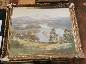 A large oil on board landscape painting of a lake scene by Dermont Hellier b1916. Picture: 88cm by