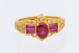 Unmarked Yellow Metal Synthetic Ruby and Cubic Zirconia Dress Ring.  The ring contains an Oval