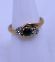 18ct Yellow Gold Sapphire & Ilusion Set Diamond ring.  The ring is hallmarked "18" for 18ct Gold.