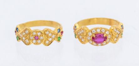 Two Unmarked Yellow Metal Dress Rings. One of the rings contains an Oval Brilliant Cut Synthetic