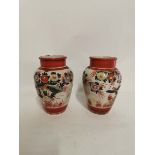 A pair of Japanese Kutani porcelain vases, hand painted with birds and flowers. Each 19cm high. Some