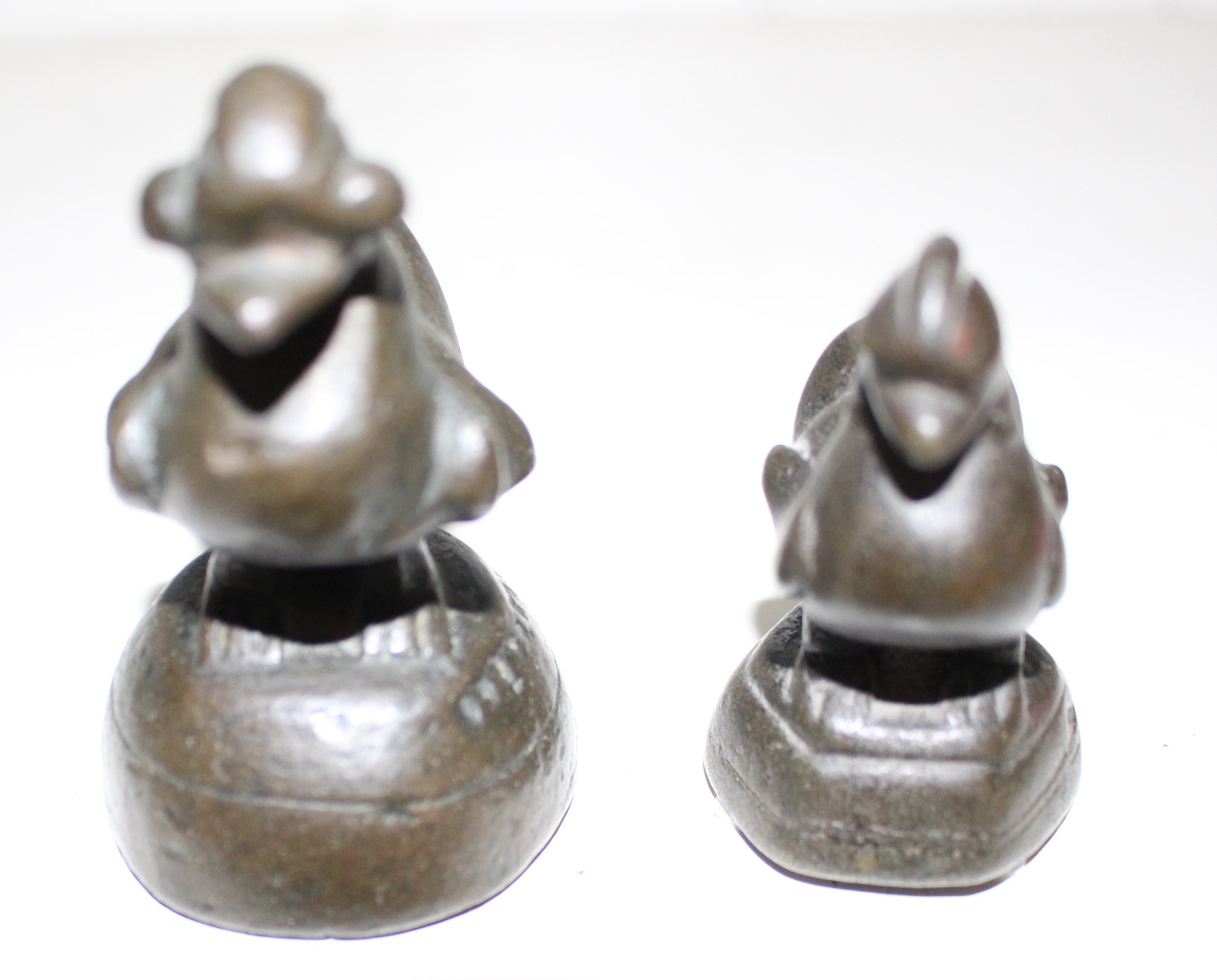 Two Burmese bronze opium weights in sizes, 6.5cm high