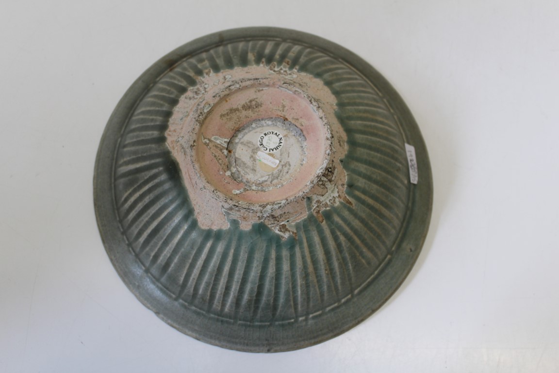 A Celadon ground pottery charger with incised decoration from The Royal Nanhai Cargo, diameter 30cm - Image 3 of 3