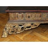 A late 19th / early 20th century Thai carved hardwood and parcel gilt opium bed, set with coloured