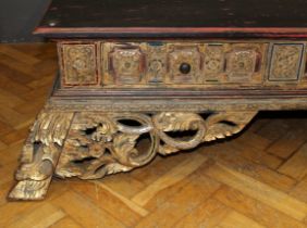 A late 19th / early 20th century Thai carved hardwood and parcel gilt opium bed, set with coloured