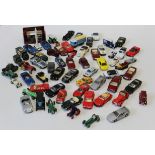 A collection of approximately fifty Dinky Toys and other die cast vehicles including Vanwall and