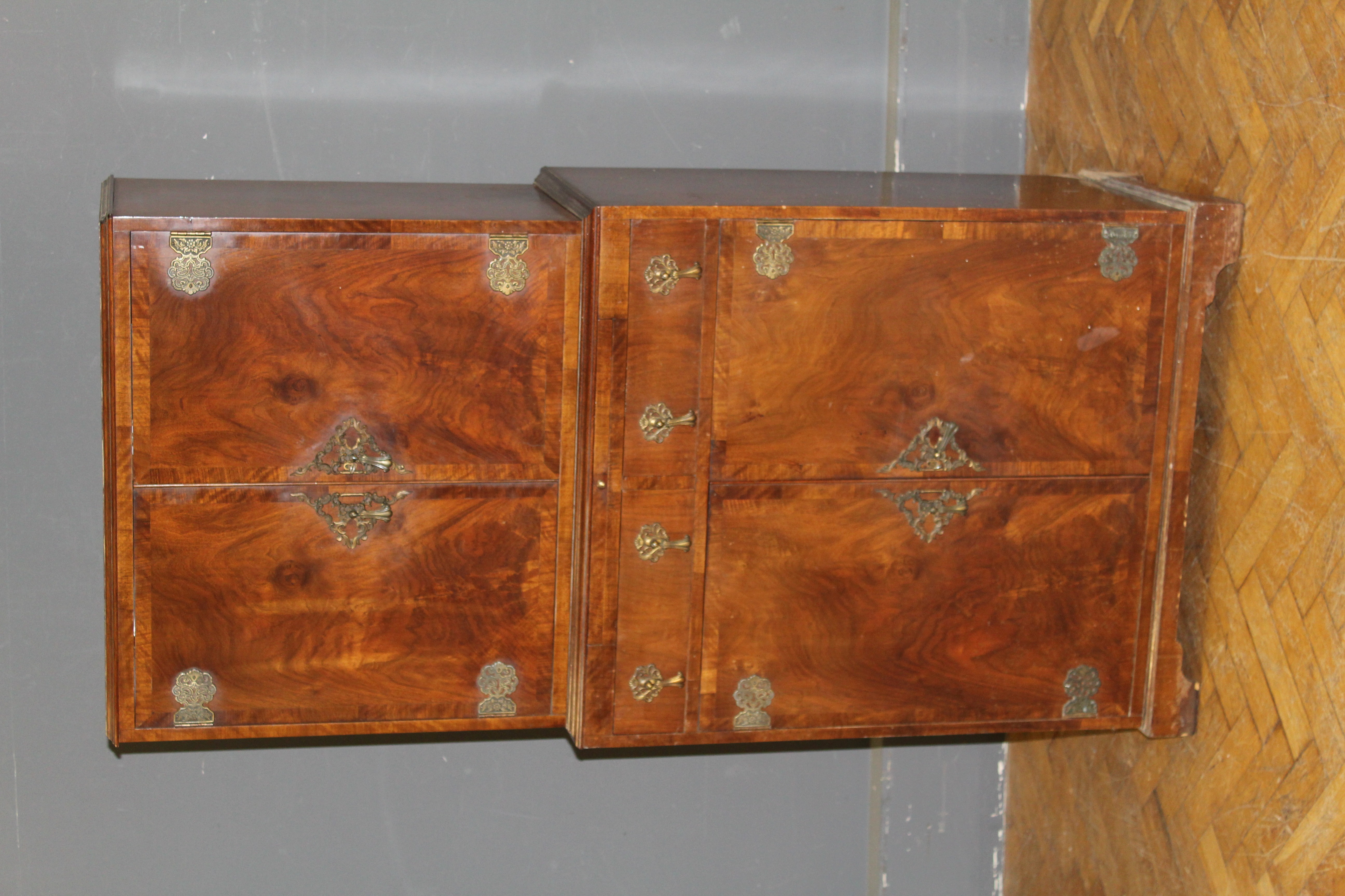 A French style walnut cocktail cabinet, by M&T London LTD, the crossbanded doors with heavy brass