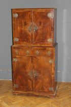 A French style walnut cocktail cabinet, by M&T London LTD, the crossbanded doors with heavy brass