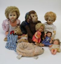 A collection of various plush toys and dolls, to include an old straw stuffed monkey, three