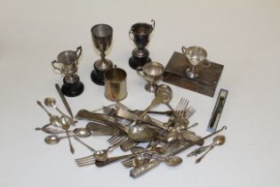 A collection of silver items, to include five various trophy cups, a monogrammed mug,  assorted