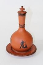 A Watcombe type Pottery terracotta onion form flask, cover and stand, transfer decorated with