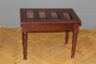 An Edwardian mahogany luggage stand with slatted top, raised on ring turned supports. 48 x 66 x