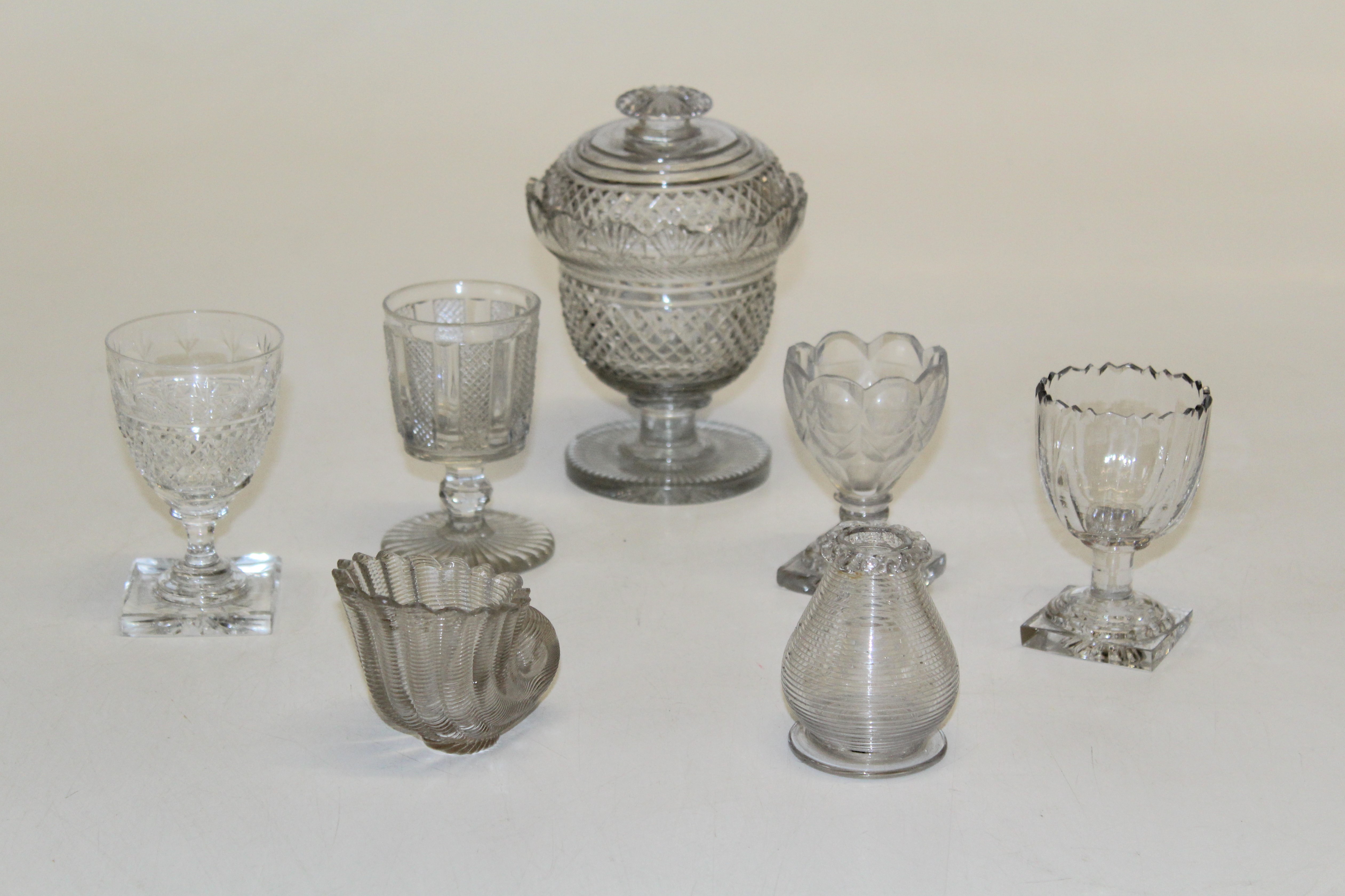 An early 19th century, possibly Irish hobnail cut glass sweet jar and cover, 15.5cm, together with