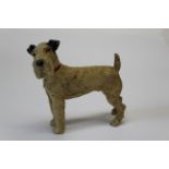 A cold painted base metal table lighter, cast as a Fox Terrier, detaching at collar to reveal