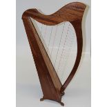 A Morley type thirty two string Celtic table harp. 102cm