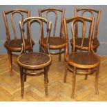 A harlequin set of five Thonet-type bentwood chairs, each with shell embossed seat