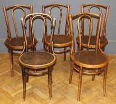 A harlequin set of five Thonet-type bentwood chairs, each with shell embossed seat