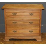 An early 20th century beech chest of drawers, in the Georgian style, with moulded drawer front and