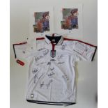 A signed 2003 England football shirt, with sixteen signatures, including David Beckham, Michael