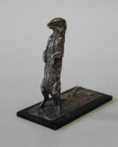 Jonathan Kenworthy ( b 1943) A silver model of a Meerkat, standing alert. Incised signature to base.