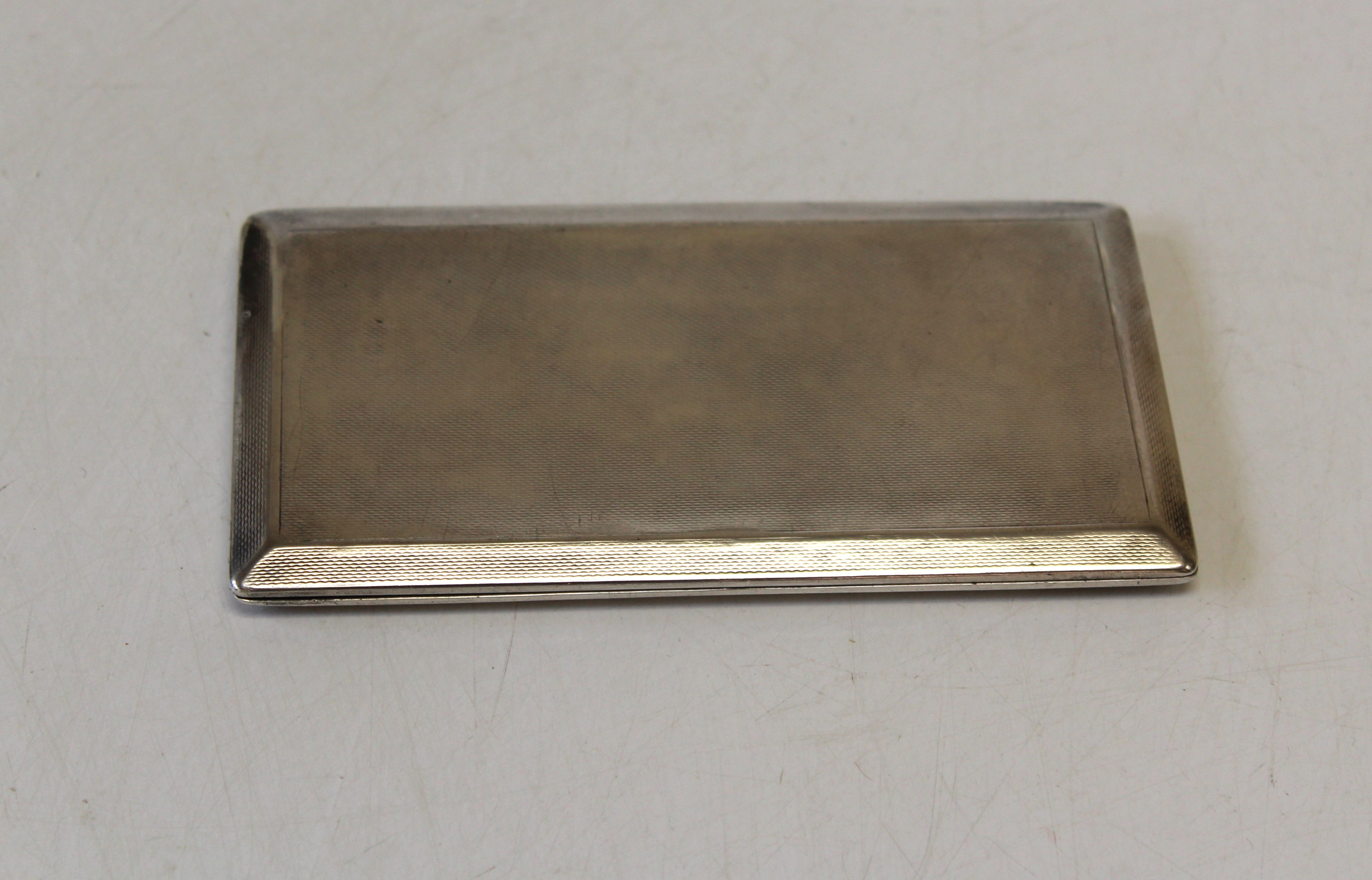 Asprey, an Edwardian silver cigarette case, patent 21914 with sliding sprung hinge and engine turned