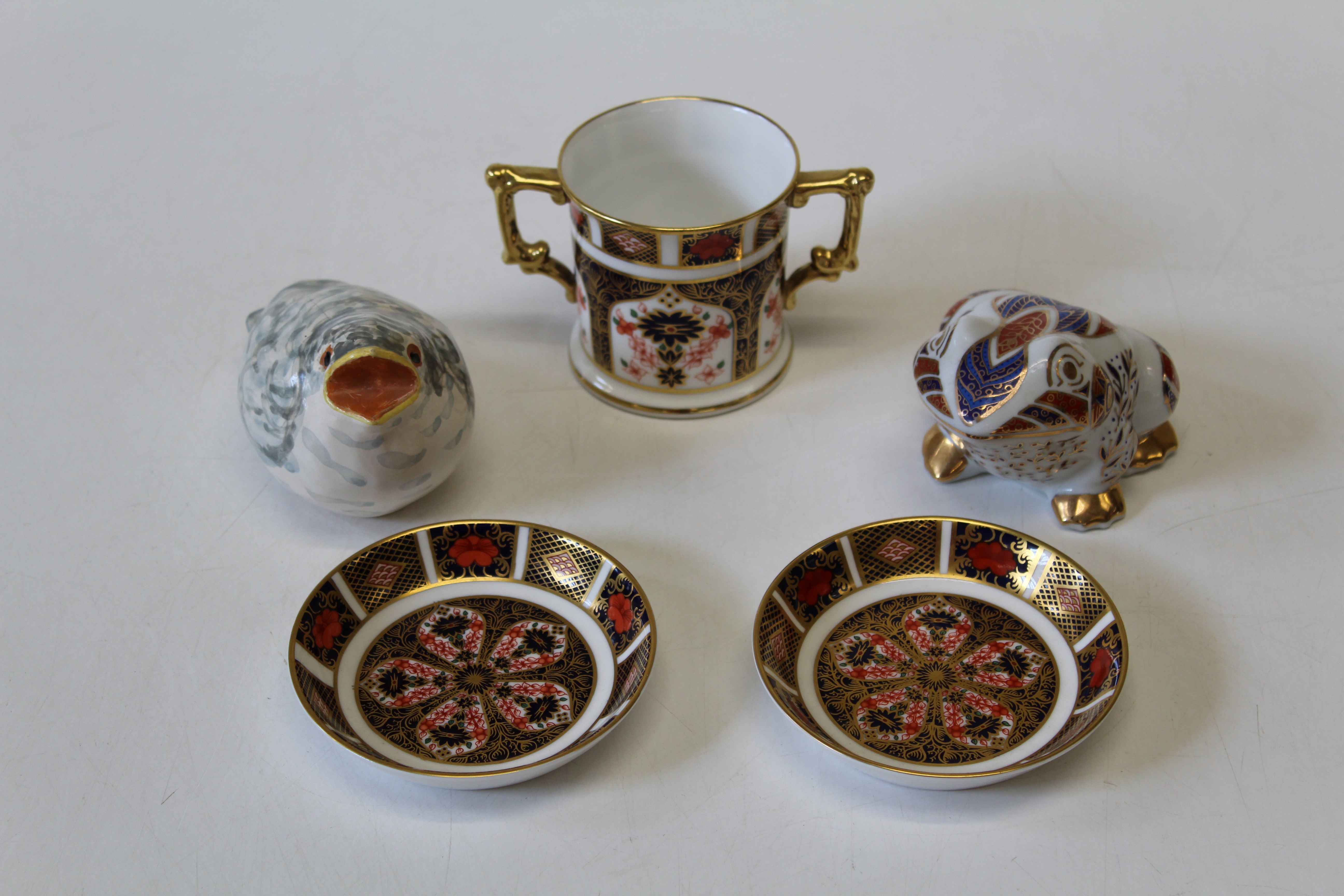 A Royal Crown Derby Imari pattern twin handled loving cup, pattern 1128, together with two Derby