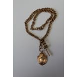 A 9ct gold double Albert watch chain, with two fob clips, t-bar and an engraved shield medallion