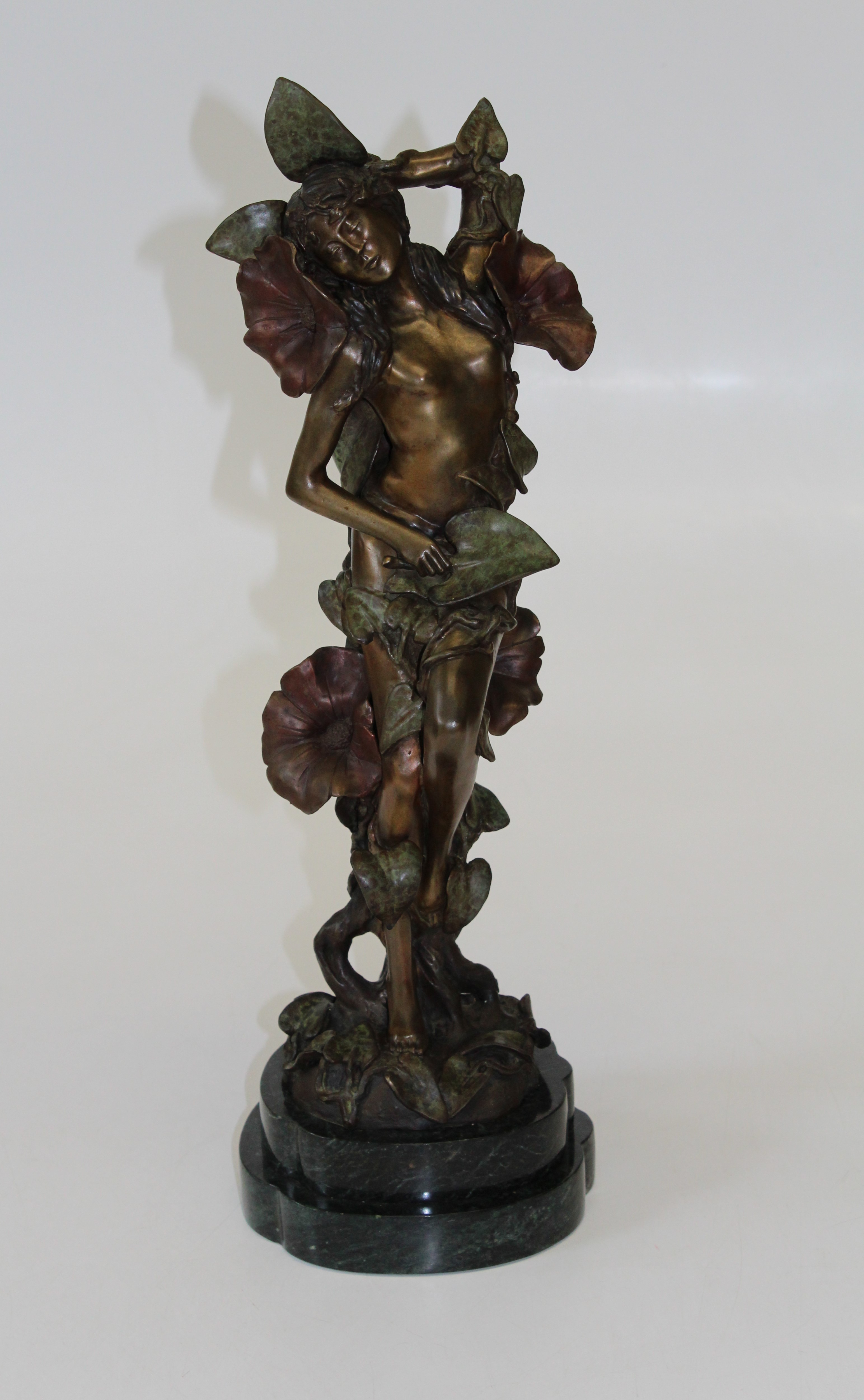 R.T. Pearce (British, b. 1956), An Art Nouveau style polychrome bronze figure of a maiden, entwined