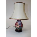 A circa 1990's Moorcroft table lamp of baluster form, decorated in Pansy pattern by Rachel Bishop,