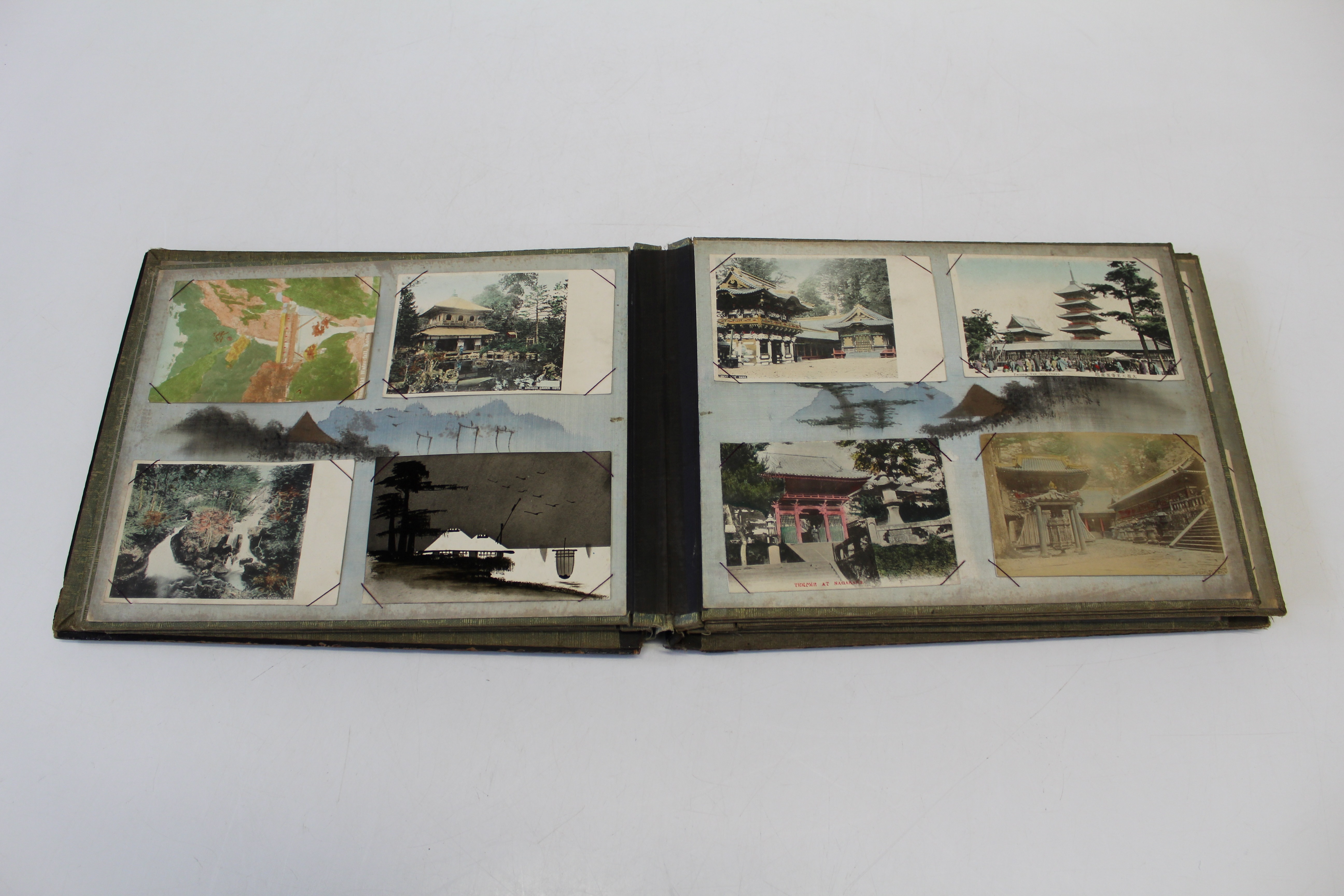 An early 20th century Japanese black lacquer postcard album, containing approximately seventy early/ - Image 2 of 3