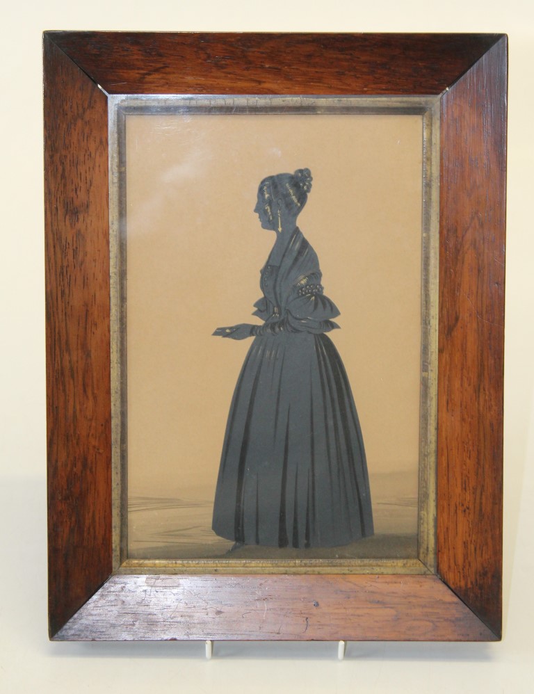 19th century English School, a full length silhouette portrait of a lady holding a letter. Cut