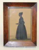 19th century English School, a full length silhouette portrait of a lady holding a letter. Cut
