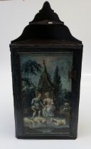 A 19th century oak wall mounting corner cupboard, the panel door painted with a courting shepherd