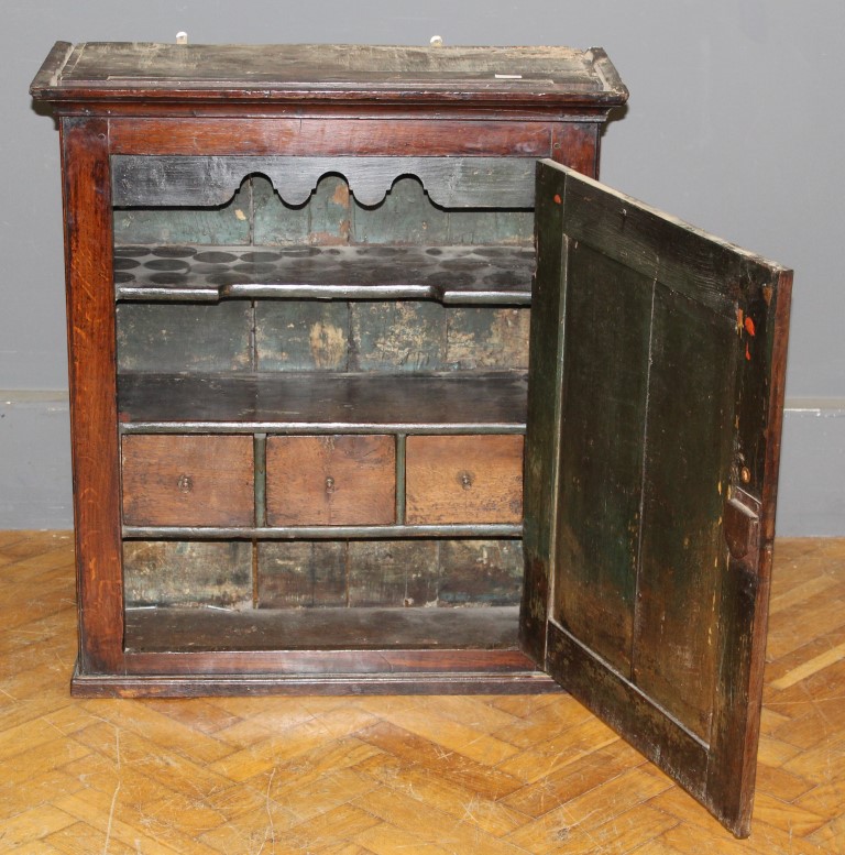 A large oak food/ spice cupboard, the moulded top over a fielded panel door enclosing drawers and - Image 2 of 2