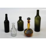 An 18th century olive green ' Dumpy' bottle, 20cm together with a triple ring neck spirit