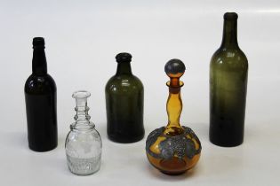 An 18th century olive green ' Dumpy' bottle, 20cm together with a triple ring neck spirit