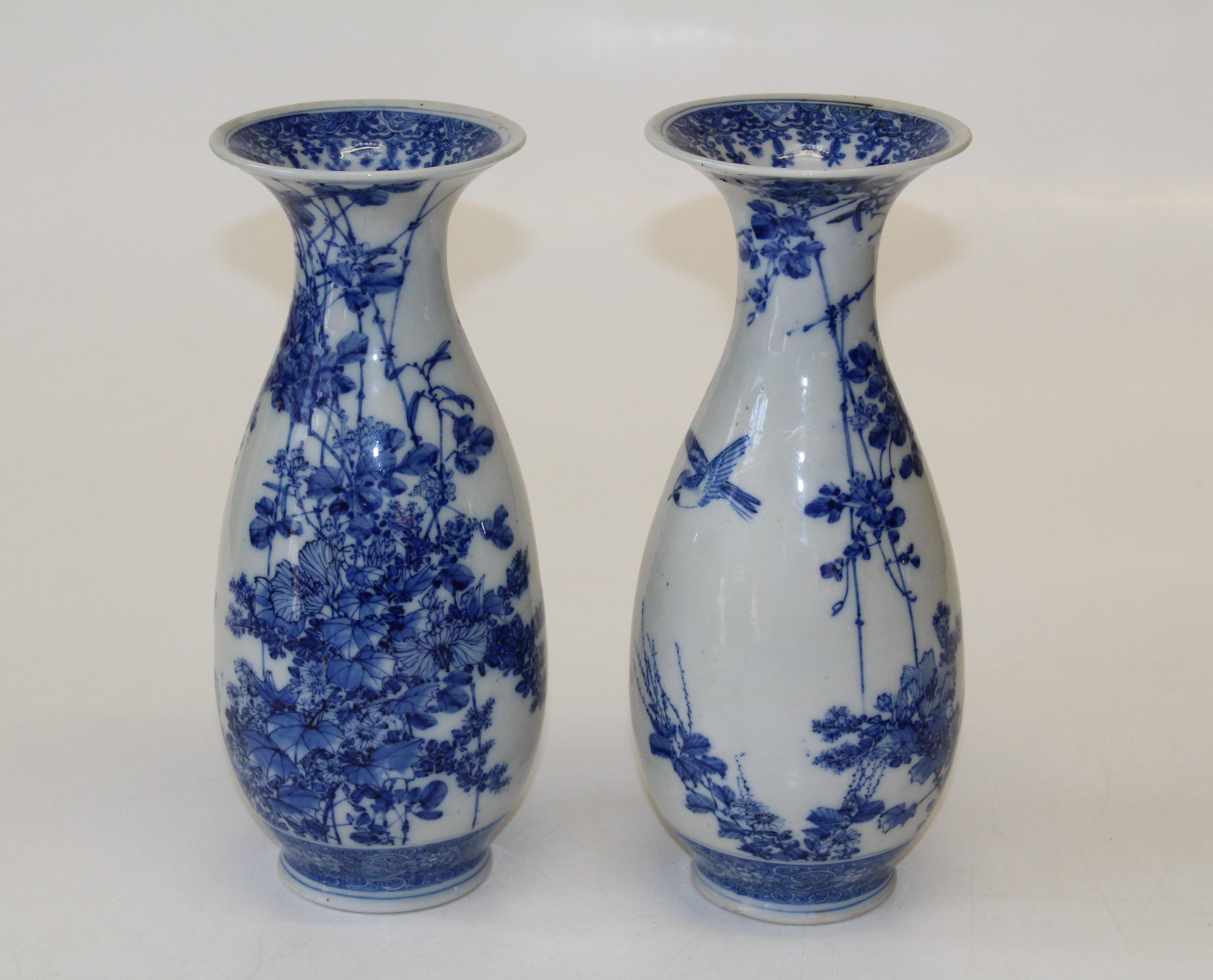 A pair of late 19th century Japanese porcelain blue and white vases of baluster form with flared