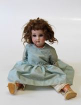 A French bisque head doll by Jules Nicholas Steiner, circa 1890, with glass eyes and jointed knees
