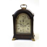 A George III ebonised and brass mounted table clock by John Holmes, London, late 18th century, the