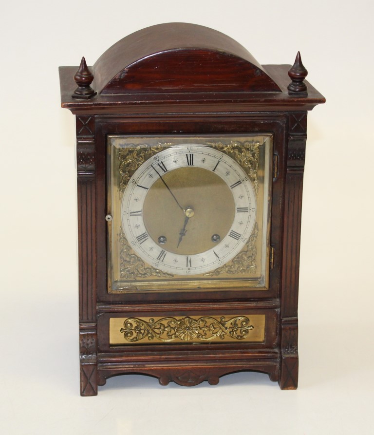 A late 19th century German mantle clock, the eight day movement striking upon gongs, in an