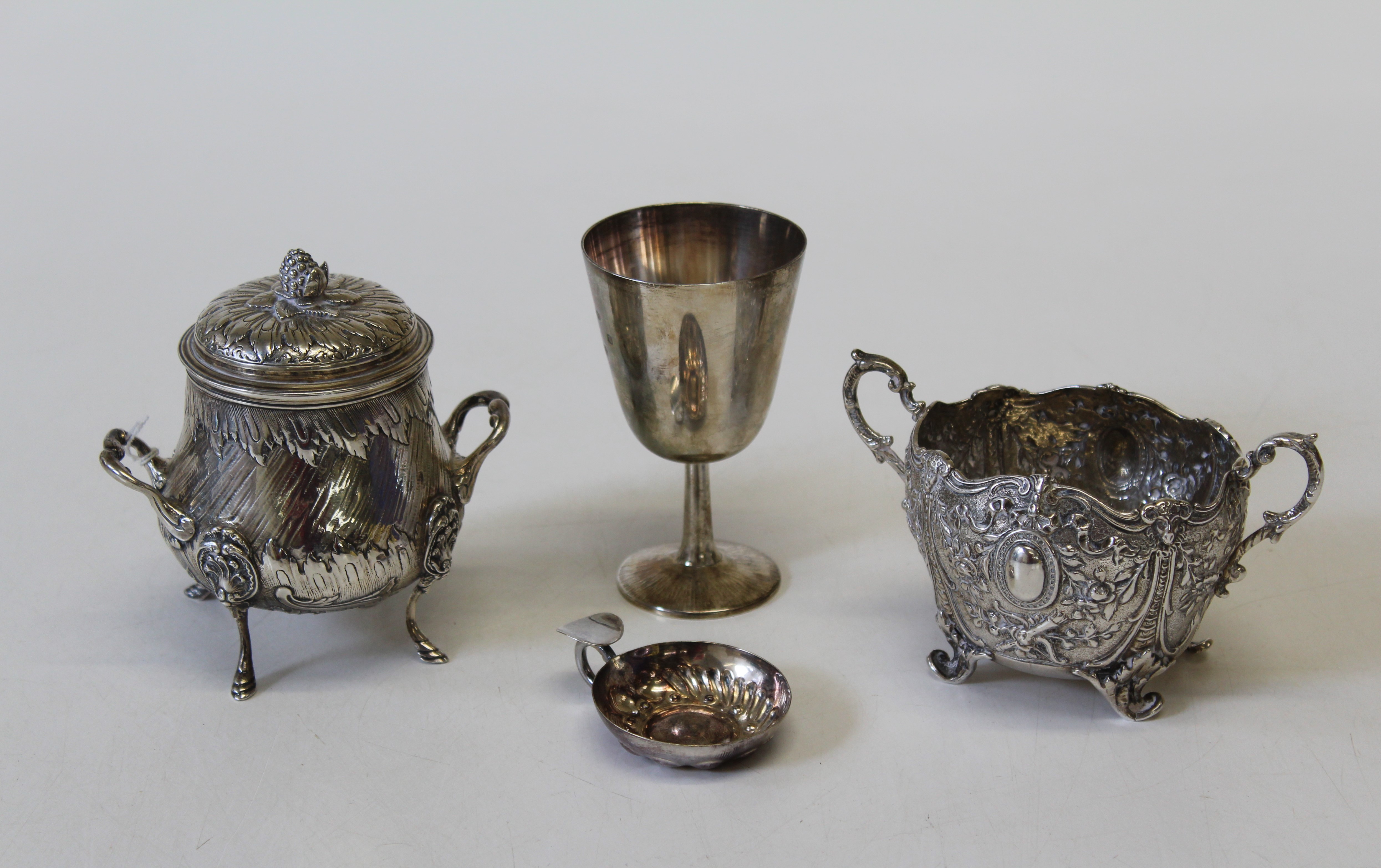 Assorted silver items, comprising a continental twin handled lidded bowl, with elaborate repousse