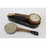 Two early 20th century banjo ukulele, one in blue plush lined case