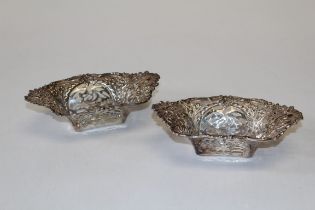 A pair of Edward VII boat shaped, pierced and embossed sweetmeat dishes, marked for Walker and Hall,