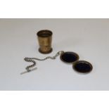 Collapsible cup into a pocket watch case with a silver Albert watch chain. Patent number I5061