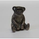 An Edwardian silver novelty pepperette, in the form of a seated teddy bear, by William Vale & Sons,