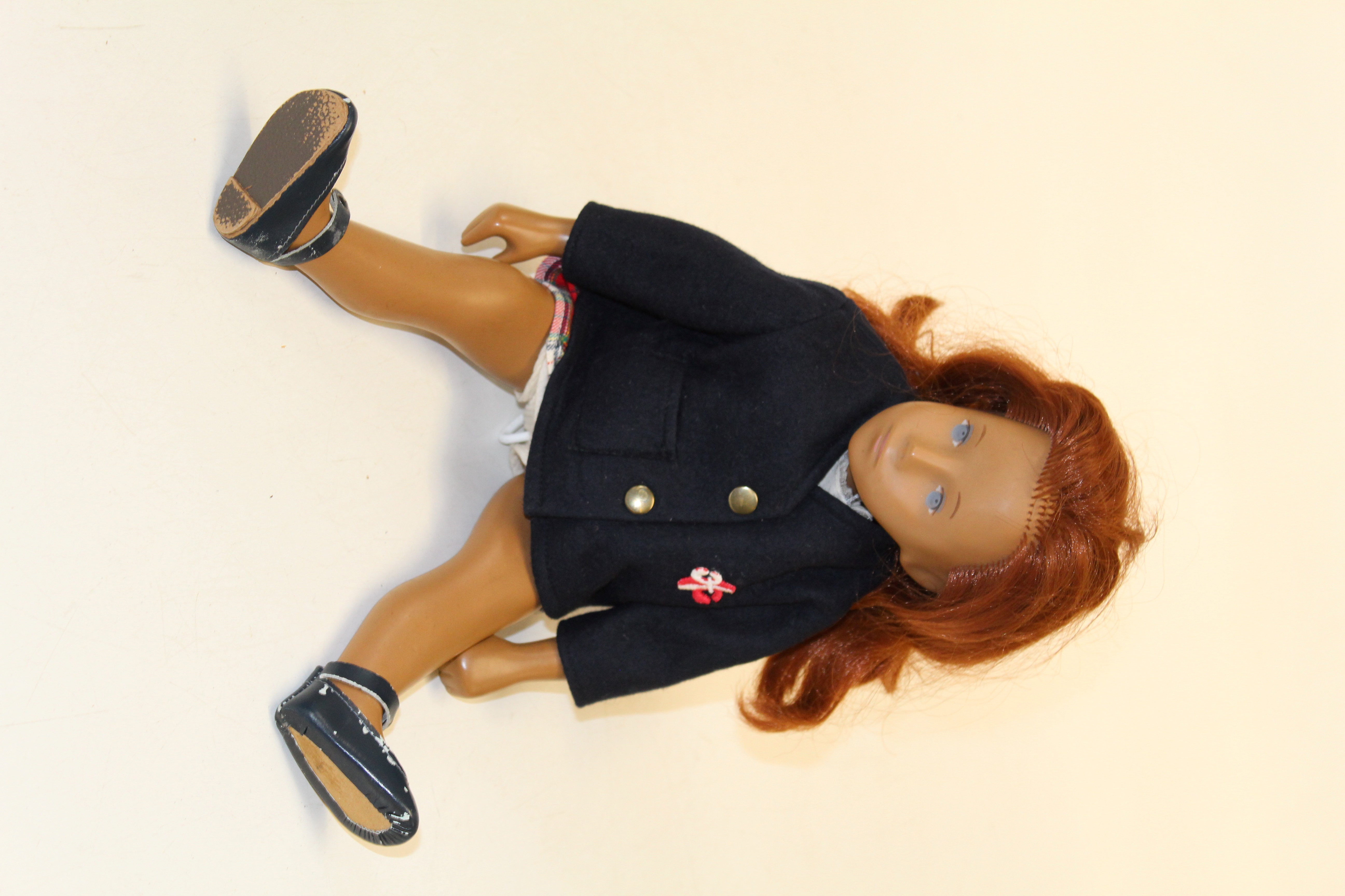 An early Sasha doll (no philtrum), with auburn hair and blue painted eyes, stamped to the back “