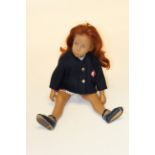 An early Sasha doll (no philtrum), with auburn hair and blue painted eyes, stamped to the back “