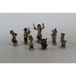 A set of seven Dresden style porcelain figures after the 18th century Meissen monkey band