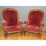 A pair of mid Victorian carved walnut gentleman's chairs upholstered in button down velvet dralon,