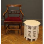 An early 19th century elm elbow chair raised on square section legs and a painted hardwood and